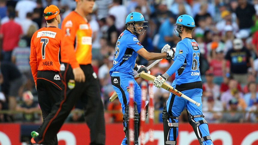 Ben Laughlin and Adam Zampa of the Strikers celebrate winning the Big Bash League match between the Perth Scorchers and Adelaide Strikers