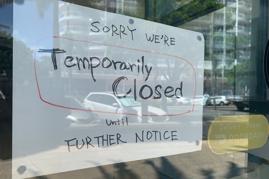sign reading 'we are temporarily closed'