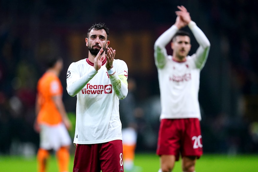 Bruno Fernandes applauds the crowd after Manchester United's Champions League draw with Galatasaray.