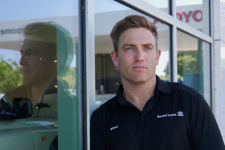 Former West Coast Eagles defender Brad Sheppard standing outside of the Broome Toyota showroom. 