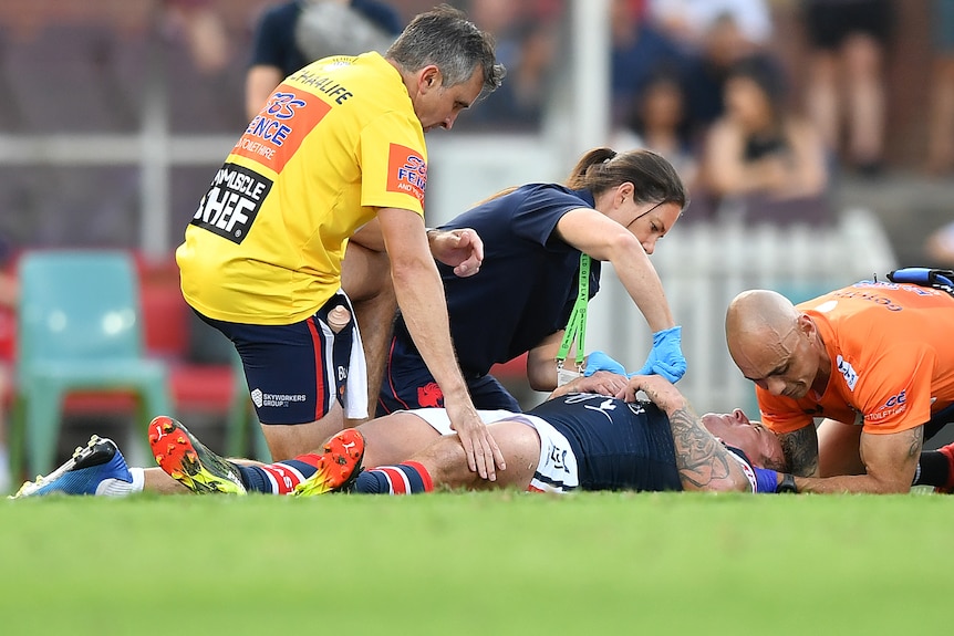 Jake Friend attended to by Roosters medical staff