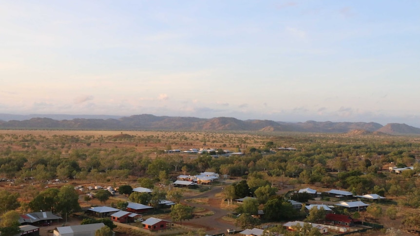 A remote town in the outback, as seen from a high vantage point.