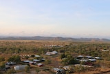 A remote town in the outback, as seen from a high vantage point.