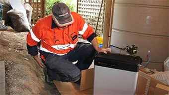 Man looking at solar battery