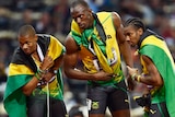 Usain Bolt, Yohan Blake and Warren Weir celebrate 200m clean sweep.