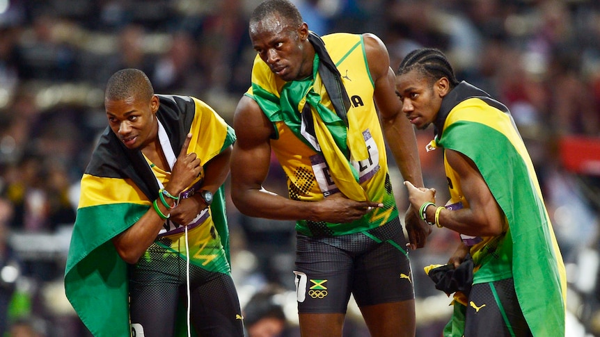 Usain Bolt, Yohan Blake and Warren Weir celebrate 200m clean sweep.