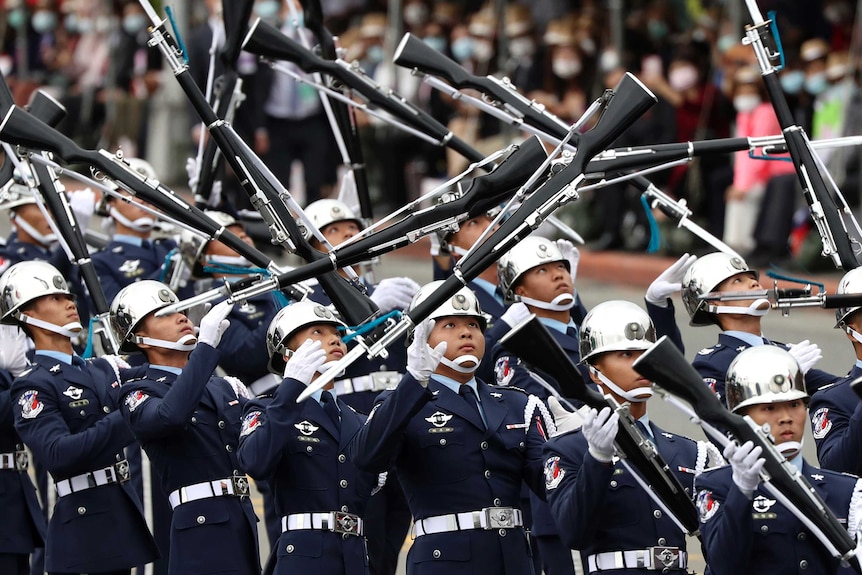 The military honour guard performs during the National Day celebrations in Taipei.