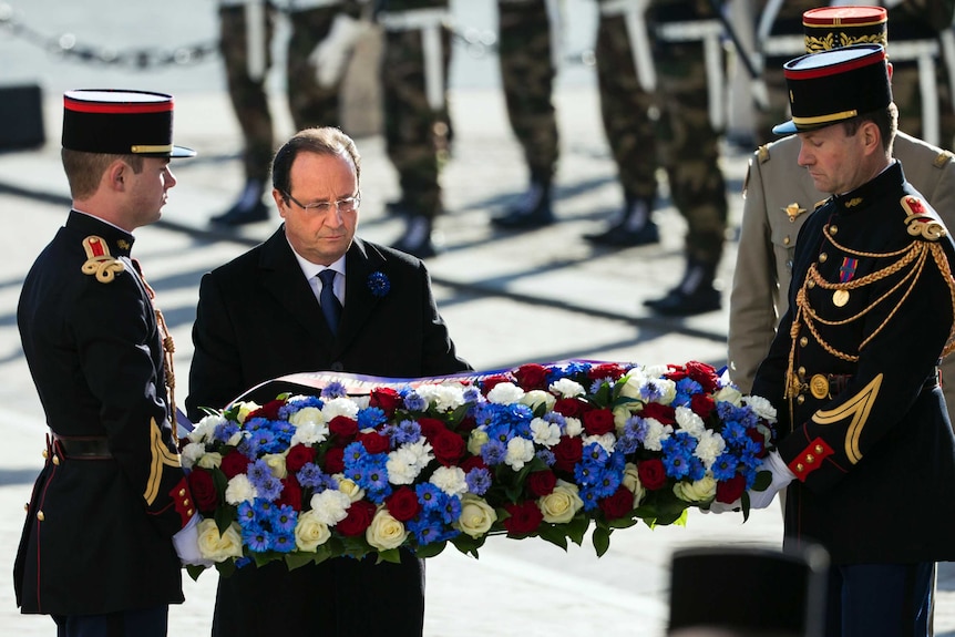 Francois Hollande lays wreath in Paris