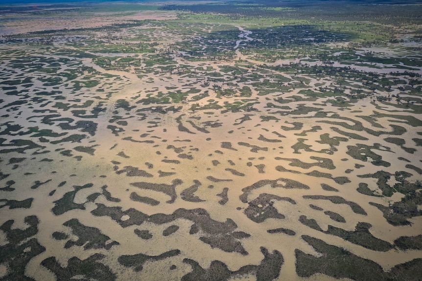 Aerial of floodwaters making patterns over the landscape