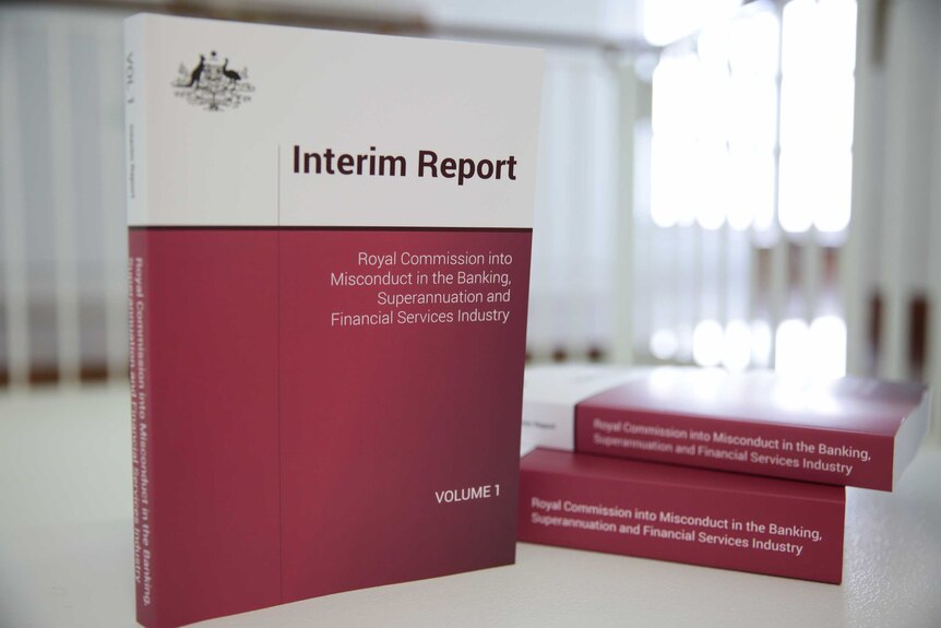 Banking royal commission interim reports on a table.