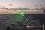 A laser beam shot from a patrol boat. 