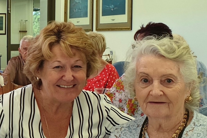 Barbara Ann Pocklington and Rosemary McMillan Brown sit at a table.
