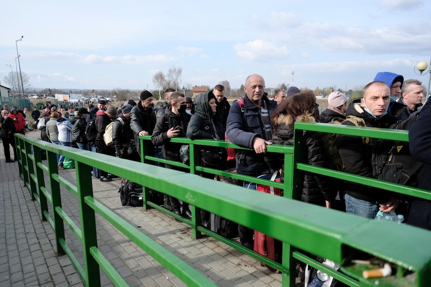People line up at the Medyka border crossing between Poland and Ukraine,