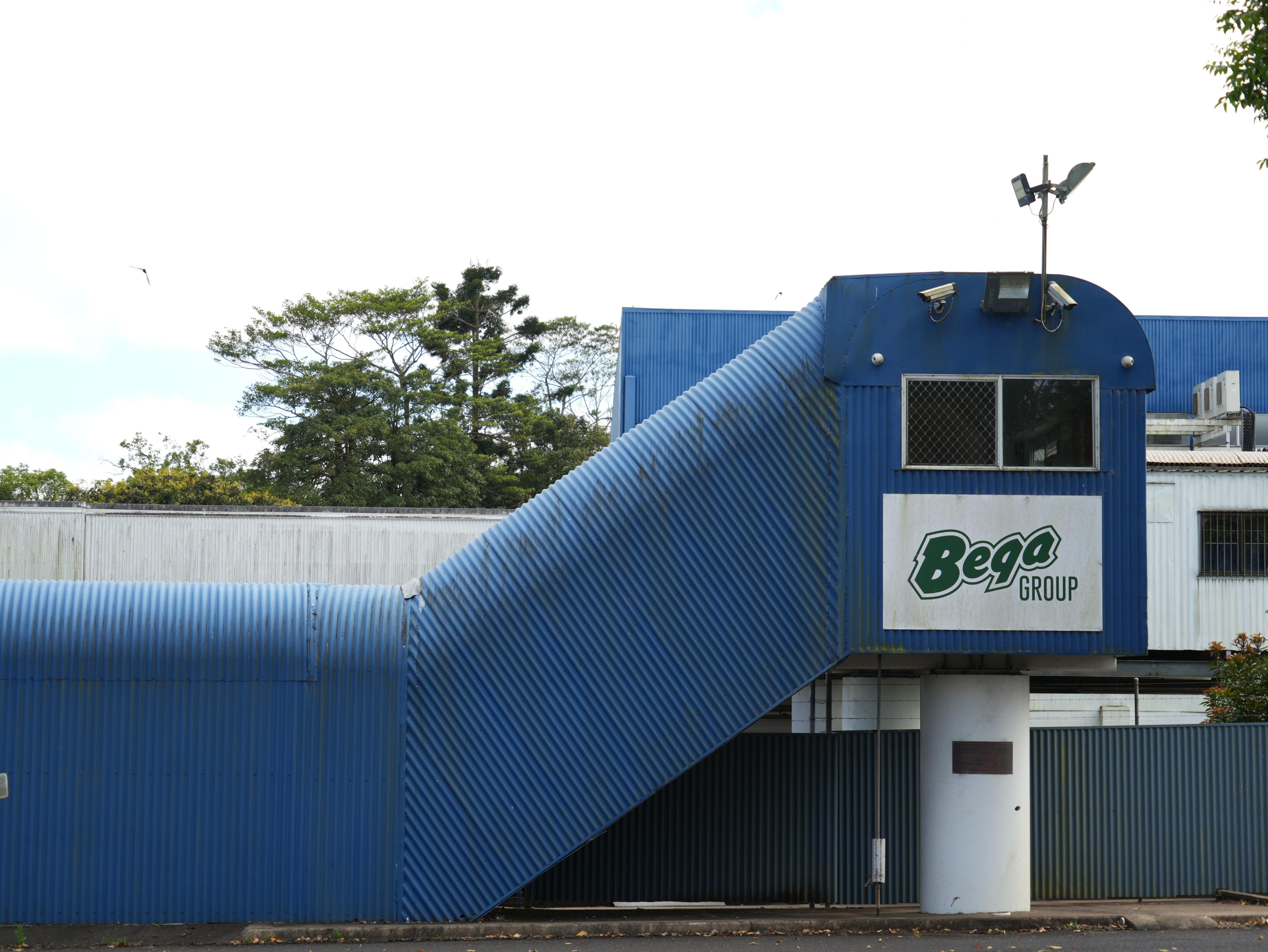 Outside the Malanda milk processing facility. The building is blue.