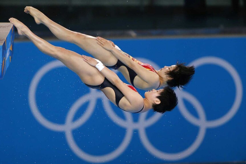 China's Chen Ruolin and Wang Hao perform a dive during the women's synchronised 10m platform final
