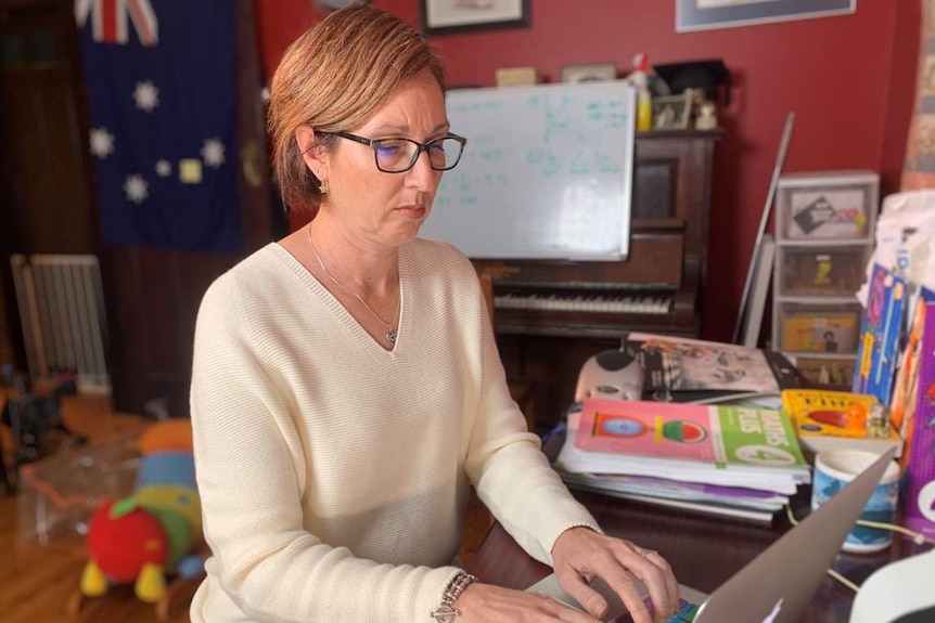 NSW primary school teacher, Janet Matthews, typing on a laptop.