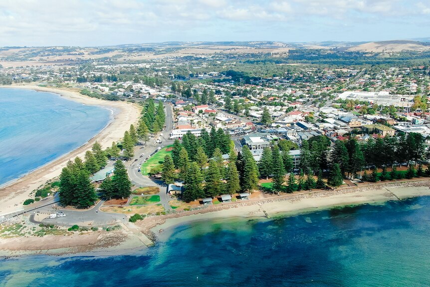 An aerial shot of the Victor Harbor township showing its beaches and the causeway to Granite Island