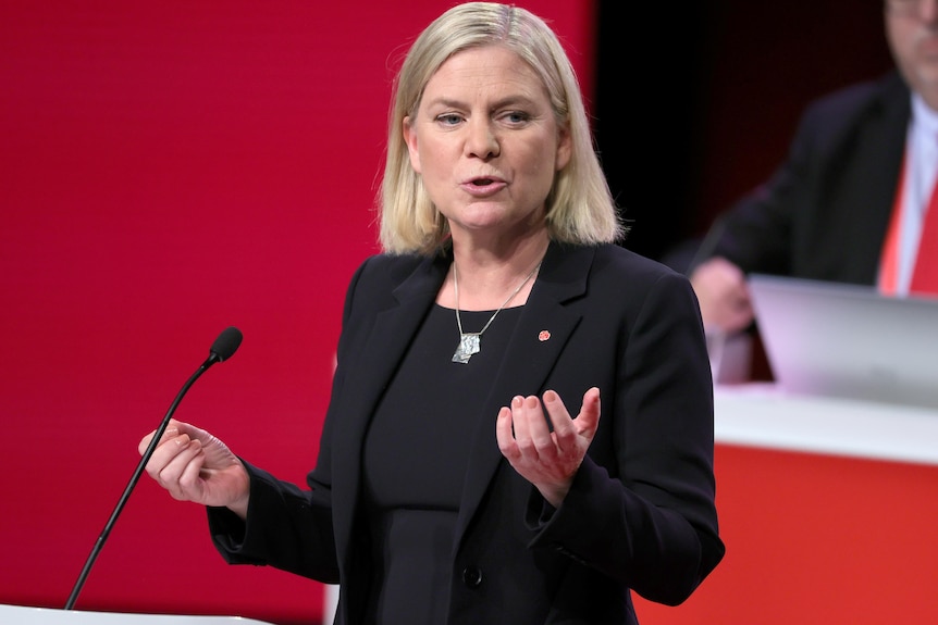 A close up of Magdalena Andersson delivering a speech in parliament.