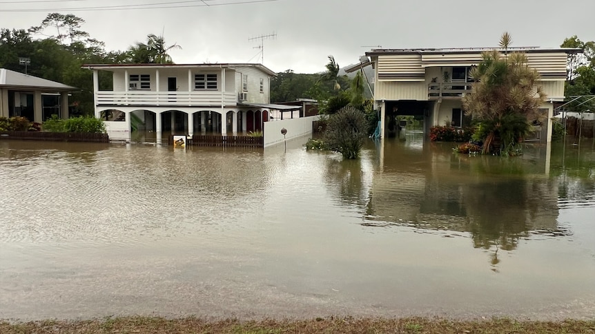 flood waters beneath a street of houses