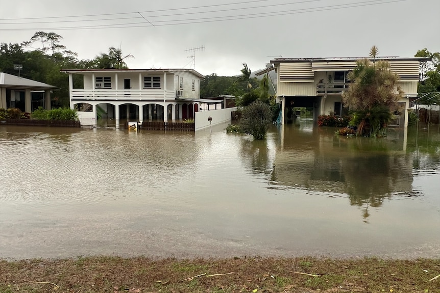 flood waters beneath a street of houses