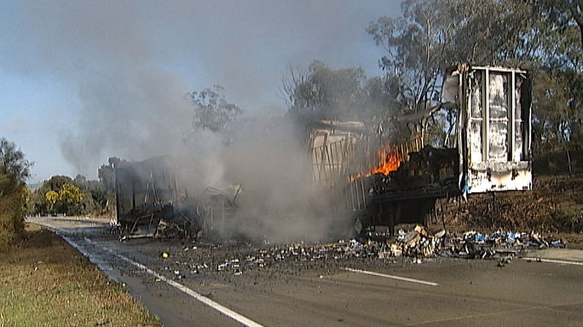 Fire erupted in the trailers of the two trucks after they crashed on the Hume Highway near Yass.