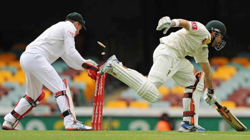 Ed Cowan stretches to make his ground