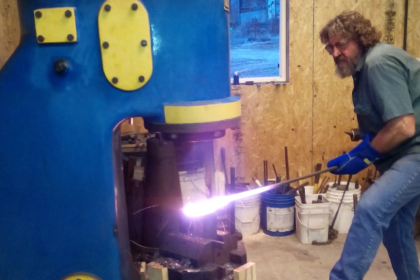 Bruce Barnett hammering Damascus 'layered' steel. 