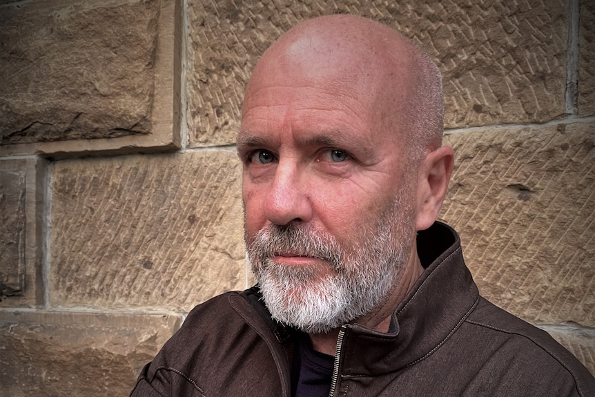 Richard Flanagan looks at the camera.