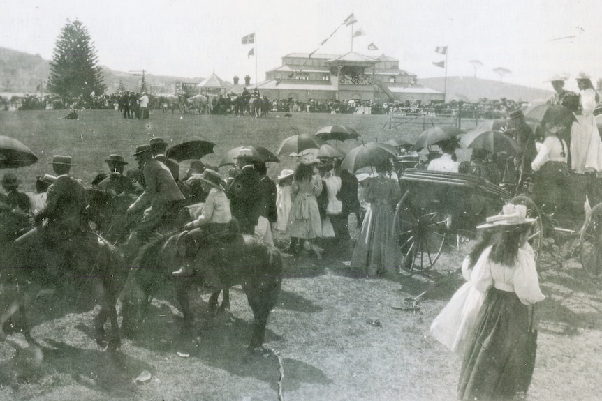 A black-and-white image of crowds at a show in the early 1900s.