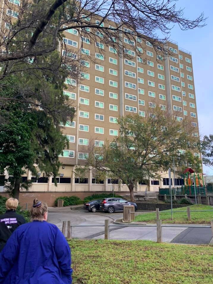Nurses approaching a public housing building in Melbourne