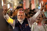 Prime Minister Narendra Modi greets supporters as he arrives at Bharatiya Janata Party (BJP) headquarters in New Delhi, India.