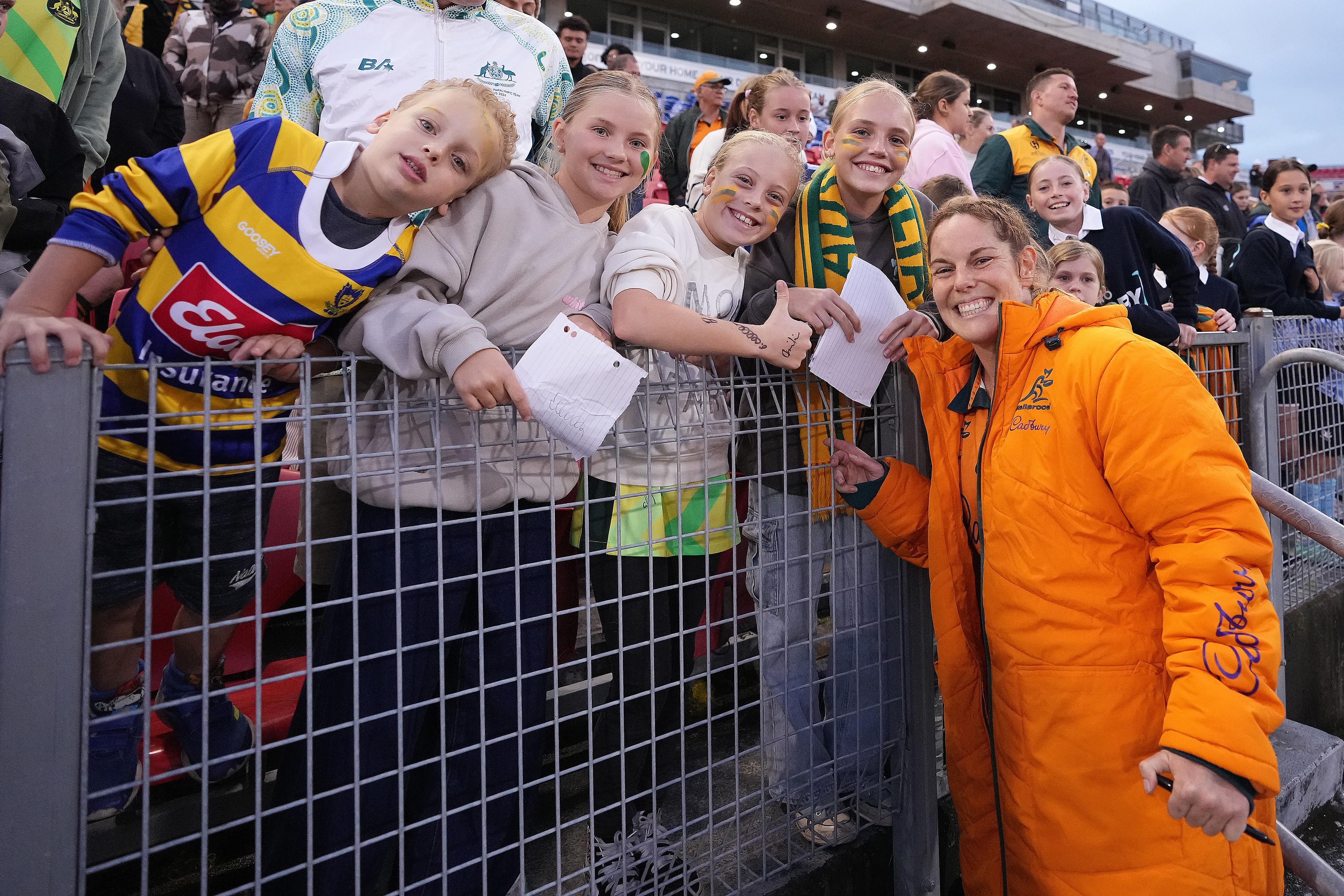 Emily Chancellor with young Wallaroos fans.