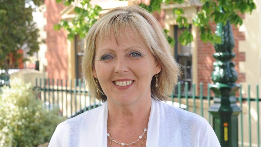 Former councillor Julie Hoskin photographed outside council buildings in Bendigo. She's smiling, wears a white blouse.