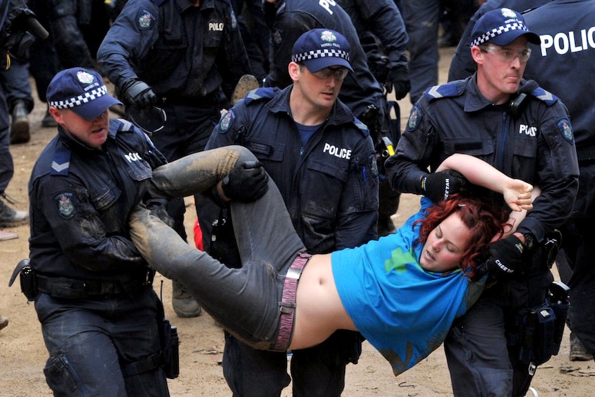 An Occupy Melbourne protester is removed by police at City Square in Melbourne on October 21, 2011.