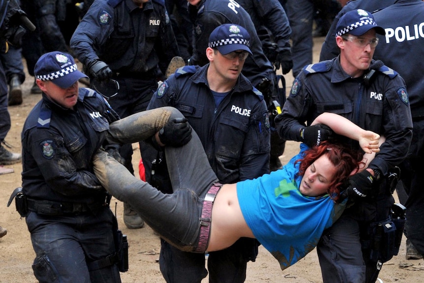 An Occupy Melbourne protester is removed