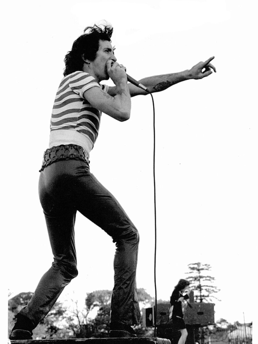 A supplied image of Bon Scott of the rock band AC/DC performing at Victoria Park, Sydney, September 1975.