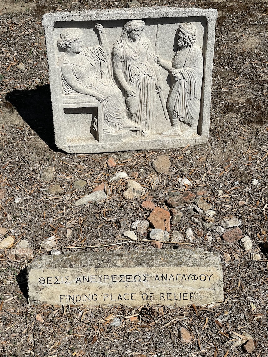 An ancient Greek plaque with the words .Finding Place of Relief'.