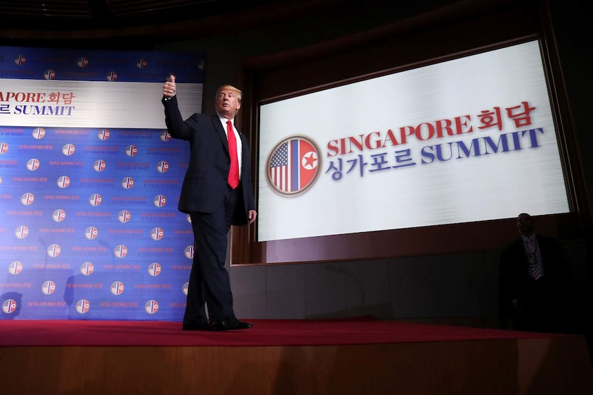 US President Donald Trump gestures after a news conference