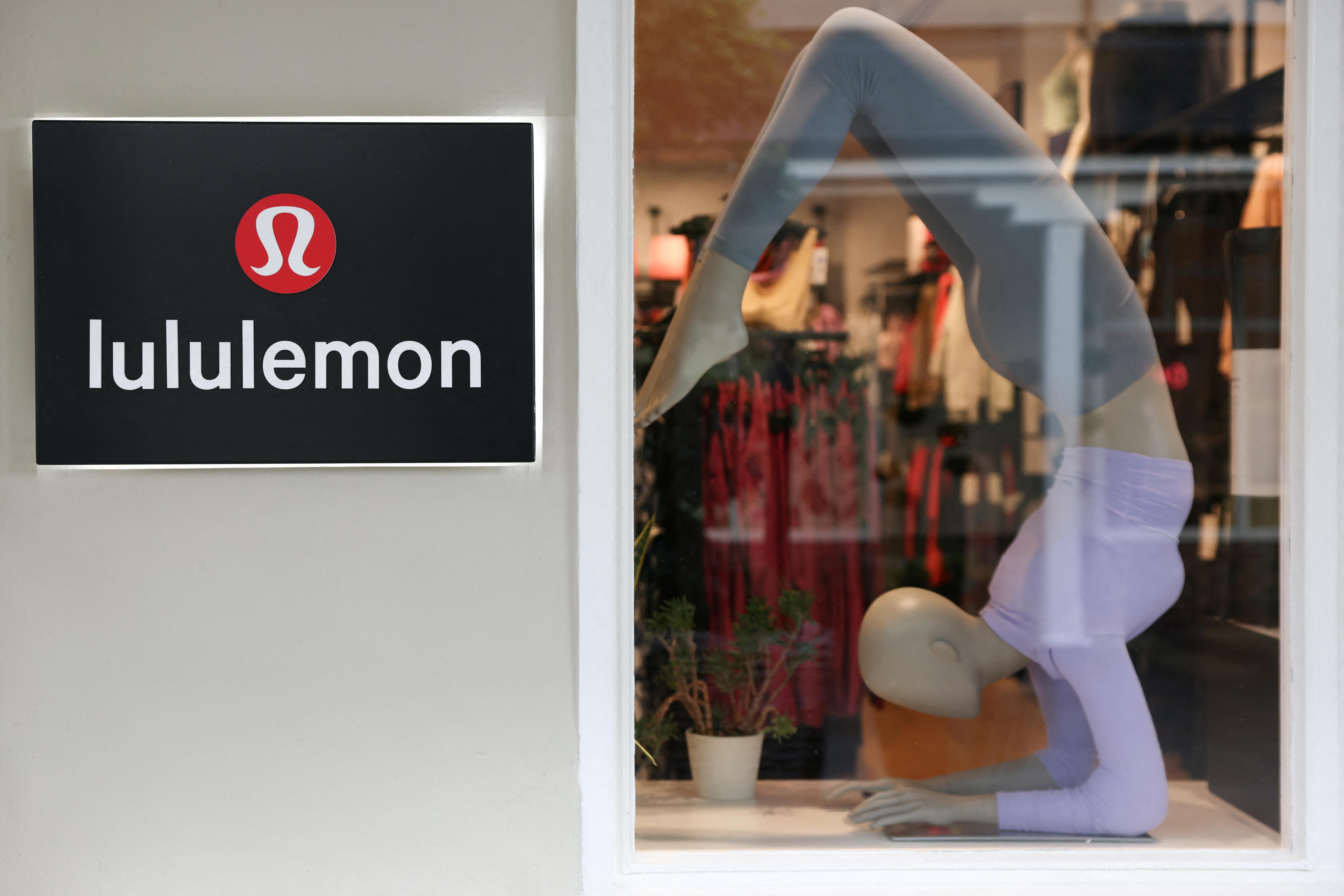A logo is displayed outside a Lululemon outlet retail store.