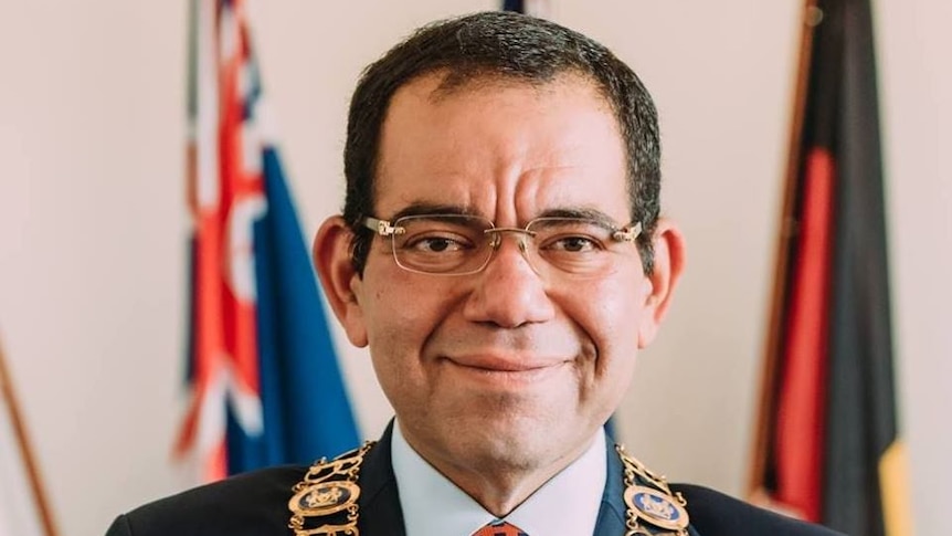 Councillor Sam Aziz wearing the mayoral chain of the City of Casey.