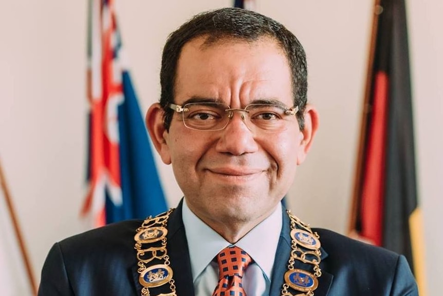 Councillor Sam Aziz wearing the mayoral chain of the City of Casey.