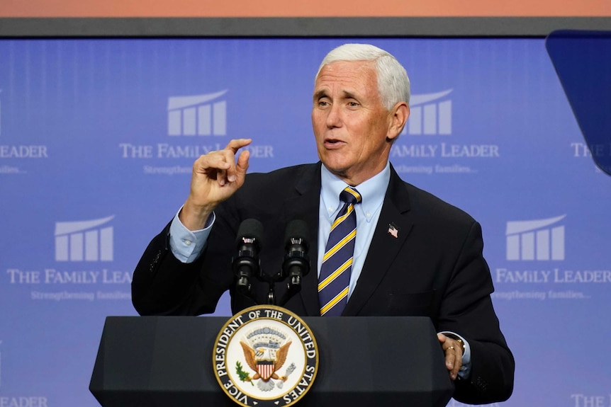 Mike Pence speaks from behind a lectern.