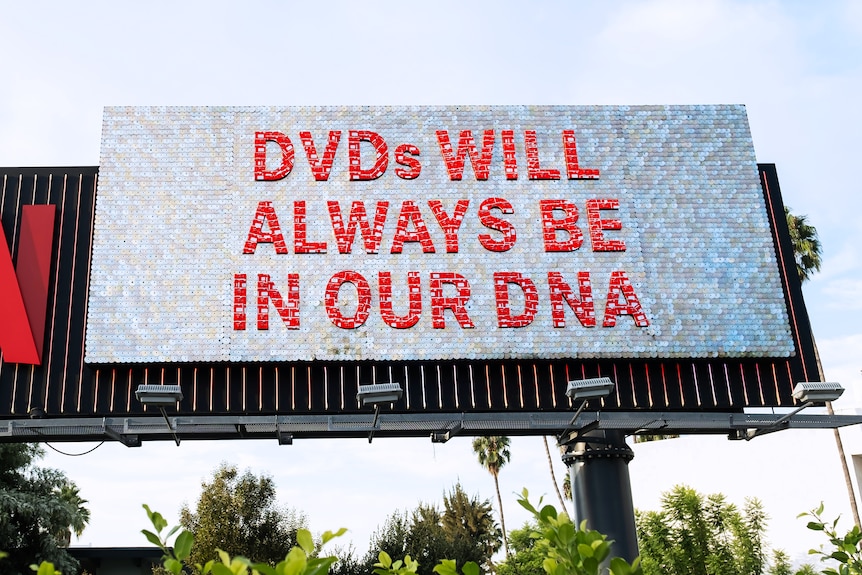 A netflix billboard with the text: "DVDs will always be in our DNA"