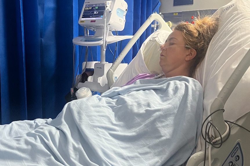 Stacey Mason recovers in hospital after her kidney transplant.