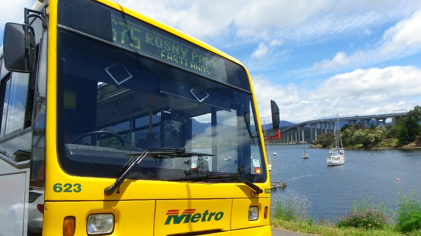 Bus parked at Rosny Point with the Tasman Bridge in the background