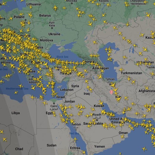 A screen shot of Flight Radar 24 showing flights diverting away from Iran.