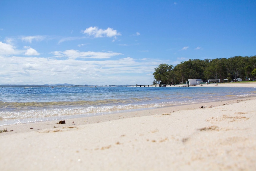 Waves lap the shore of Little Beach.