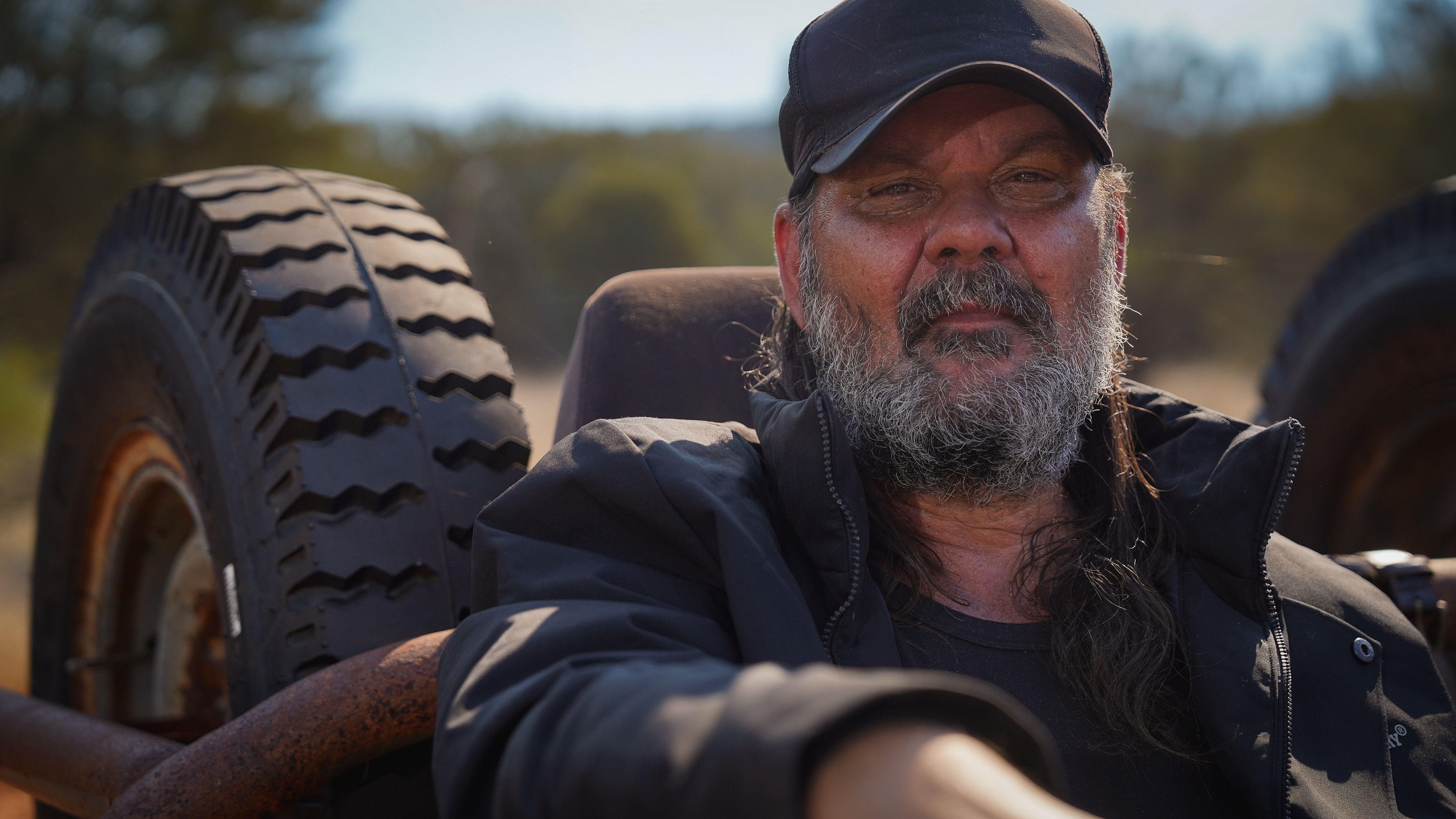 Warwick Thornton poses in the seat of his bull catcher.