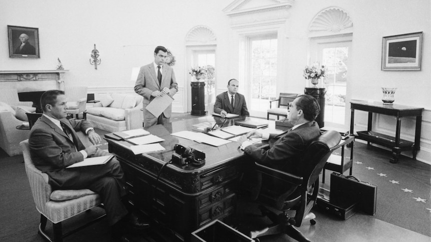 A photo of President Richard Nixon meets with chief advisers in the Oval Office in 1970