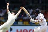 Australian cricketer Marsh (L) jumps, attempting to catch a ball off the batting of Sri Lanka cricketer Dinesh Chandimal.